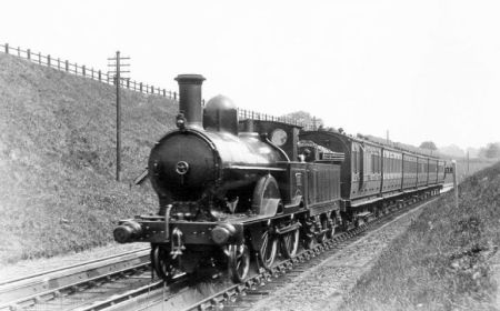 A Roberts 2-4-0 with a train of six-wheelers